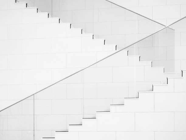 White stairs with Glass railing Modern building design Architecture details stock photo