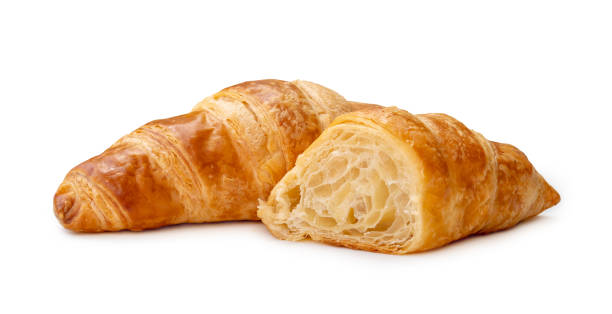 istock single piece of croissant with half isolated on white background with clipping path 1492290552