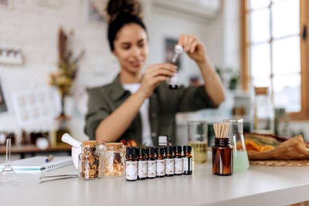 istock Young female small business owner working at her home based cosmetic workshop 1492290919