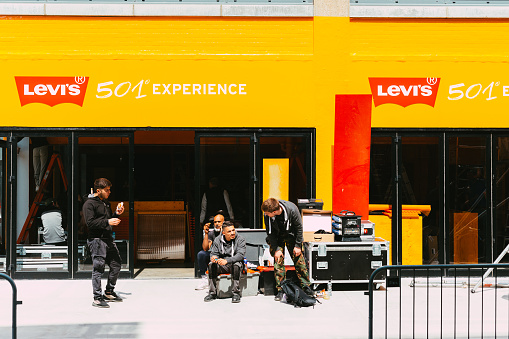 London, UK - 16 May, 2023: people outside the Levi's 501 Experience, a pop-up installation celebrating the 150th anniversary of Levi's.