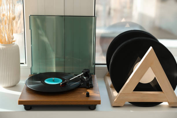 istock Vinyl records and player on white window sill 1492291678