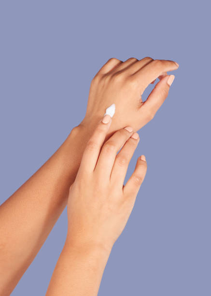 istock Hands, skincare and cream cosmetics in studio isolated on a purple background for hydration. Product, dermatology and woman or female model with lotion, creme or moisturizer   for beauty aesthetics. 1492297399