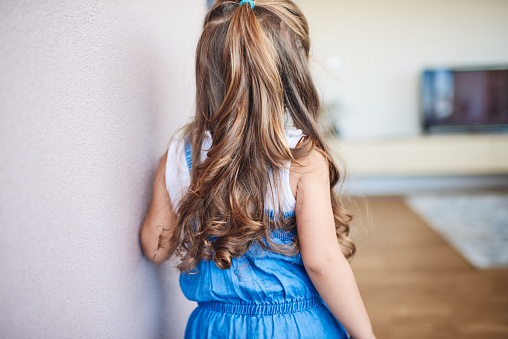 Shoot from back. Beautiful long hair of a little girl.