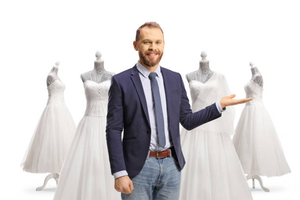 istock Young professional man pointing at bridal gowns 1492299898