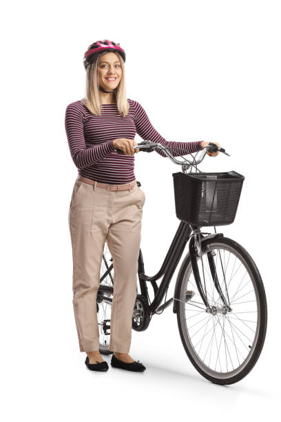 istock Young woman with a helmet standing with a bicycle 1492300013