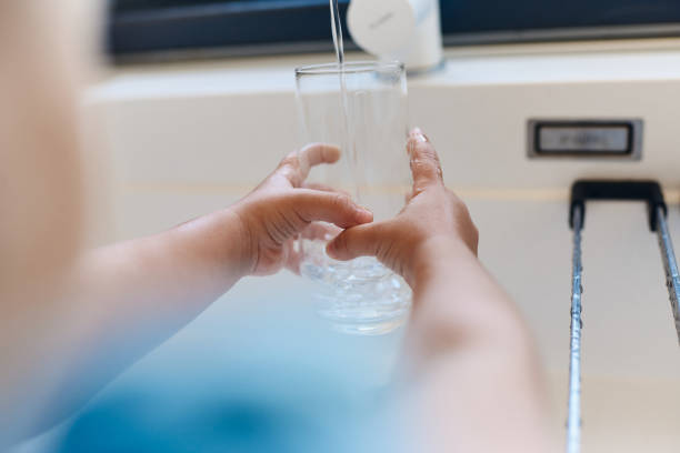 istock Child's hands taking tap water 1492300141