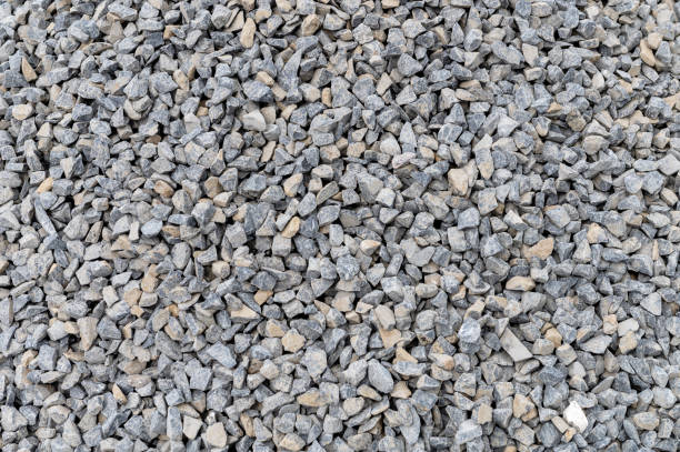 istock Grey granite gravel background for mix concrete. Crushed stone as a background. Construction rock. 1492303738