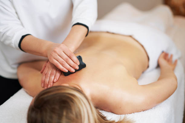 istock Woman having a gua sha massage in salon 1492304147