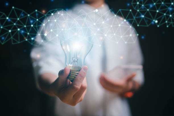 istock Women holding light bulbs, ideas of new ideas with innovative technology and creativity. concept creativity, Branch with bulbs that shine glitter. 1492304331