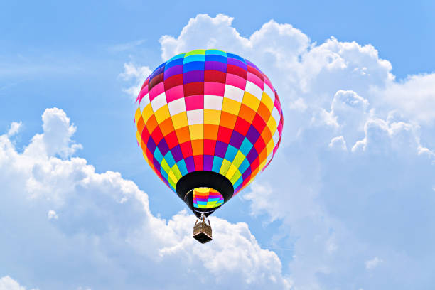 istock Hot air balloon flight over blue sky 1492304505