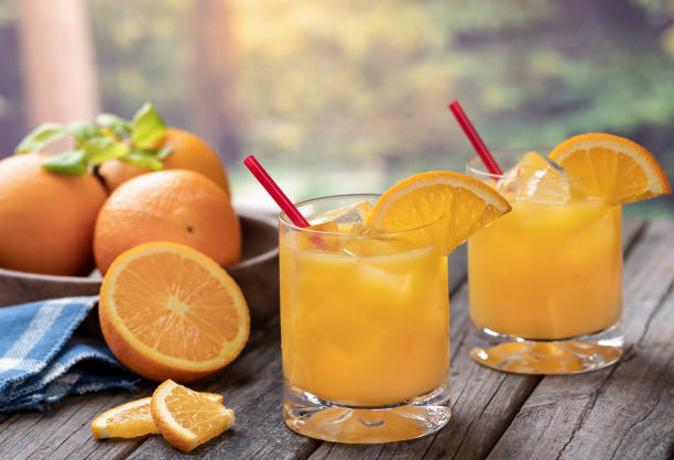 istock Orange juice cocktail in glasses with orange slices 1492304733