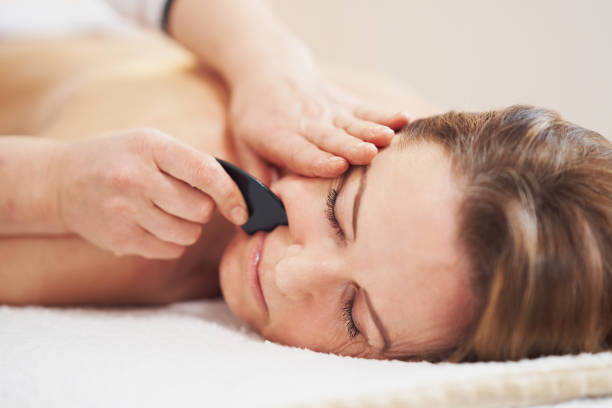 istock Woman having a gua sha massage in salon 1492304735