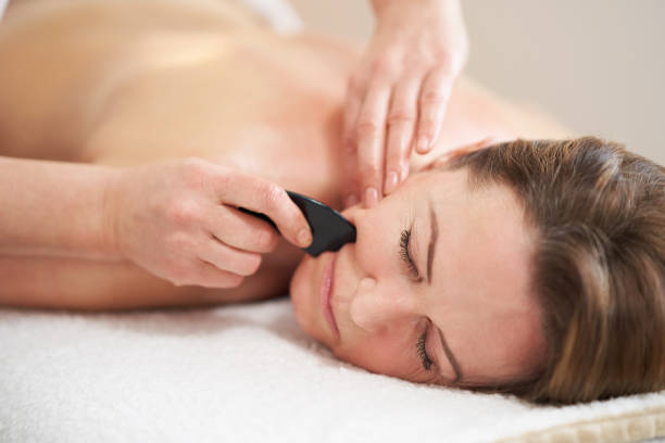 istock Woman having a gua sha massage in salon 1492305297