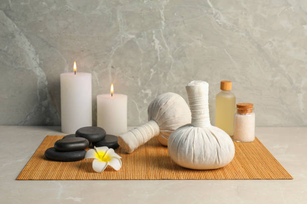 istock Spa bags, sea salt and essential oil on light gray table 1492305770