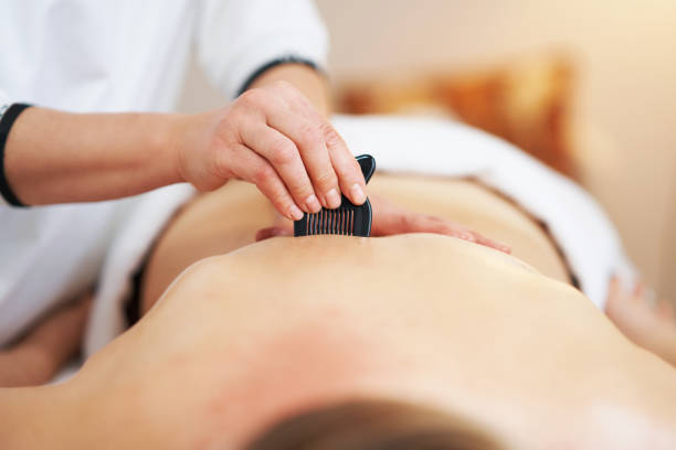 istock Woman having a gua sha massage in salon 1492305856