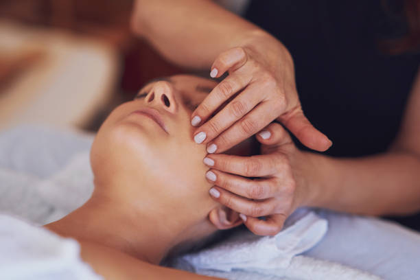 istock Woman having japan style face massage in salon 1492307640