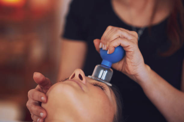 istock Woman having a face cupping massage in salon 1492307695