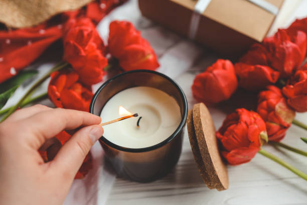 istock Match in hand lights a candle, atmospheric photo 1492308057