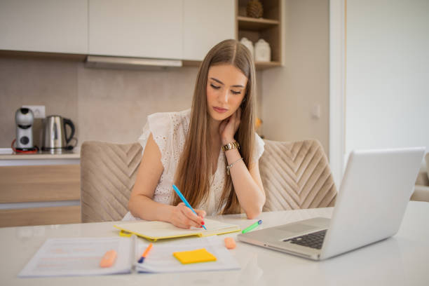 istock Young woman is studying from home 1492309462