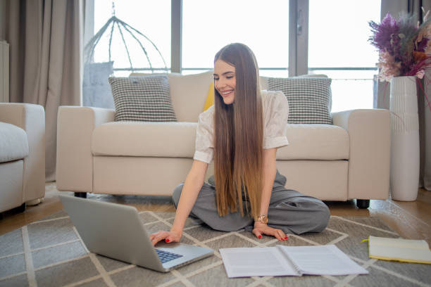 istock Happy young woman is learning online 1492309644