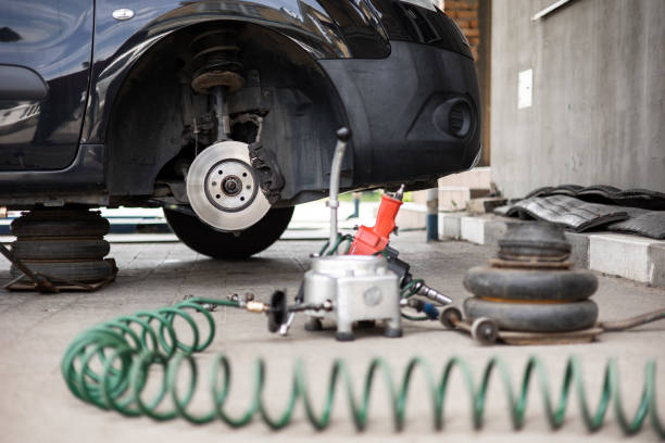 istock Tire change. Brake discs without tire with instruments on the ground 1492310517