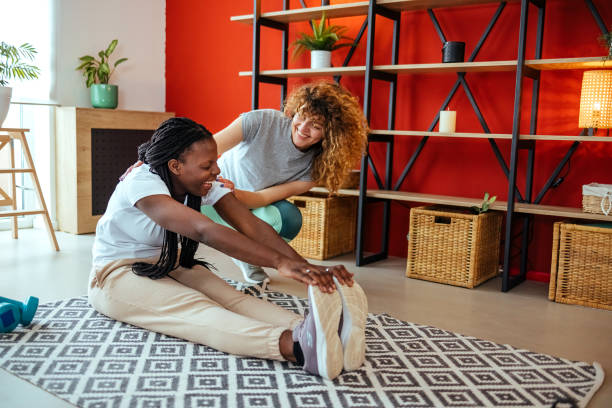 istock Two women exercising in a living room 1492310667