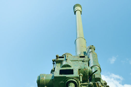 Old cannon from the Second World War, aimed at the sky. Monument to old weapons close-up. Symbol of the end of the war. Old military weapons. Equipment of the countrys armed forces. Mock up.