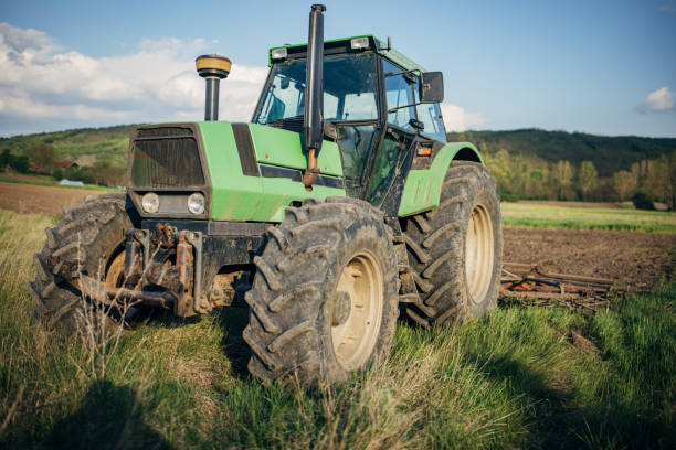 istock Tractor on the agricultural field 1492311353