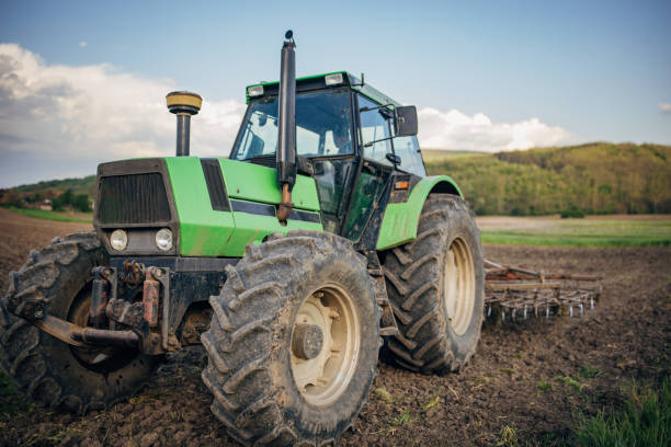 istock Tractor on the agricultural field 1492312842