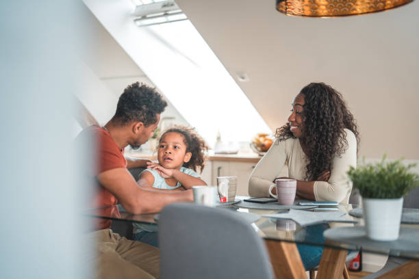 istock Diverse Family Reading Books And E-Books At Home 1492313233