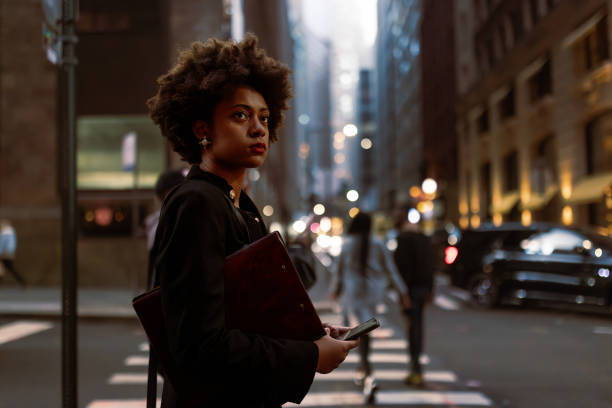 istock On the Go: Ambitious Businesswoman Balancing Taxi Arrival, Document Folder, and Email 1492315463