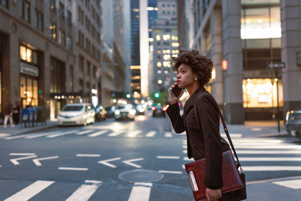 istock Busy and Focused: Young Black Professional on Wall Street 1492315503