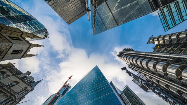 4K Footage Time lapse of Low angle view of business corporate building skyscraper in downtown district of London, England, United Kingdom