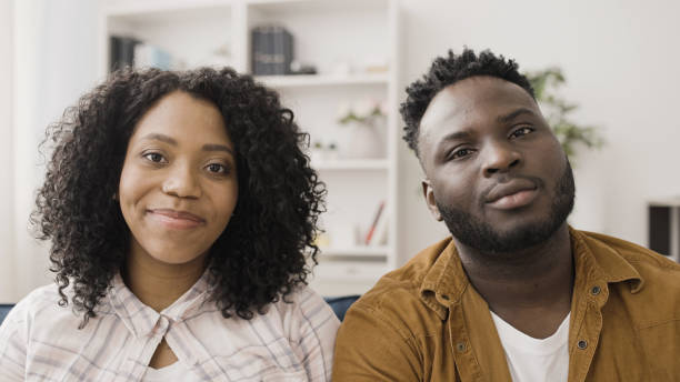 istock Happy cheerful couple in love looking at camera with tenderness, devotion 1492318699