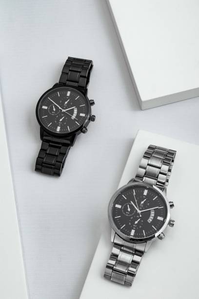 istock Luxury black and silver watch on white table. Monochromatic concept. Complementary color concept 1492327365
