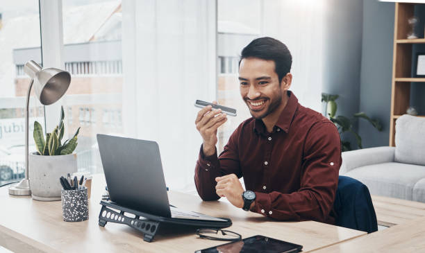 istock Speaker phone call, laptop or happy man in conversation, networking or consulting with digital communication contact. Recording app, text to speech software or office consultant talking on voice note 1492327386