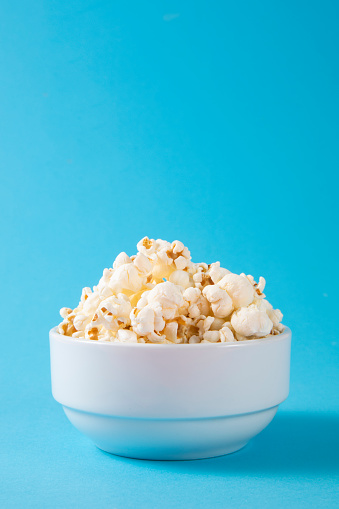 Popcorn on blue background