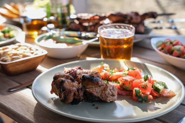 istock Summer picnic with barbecue, vegetables and beer 1492332111