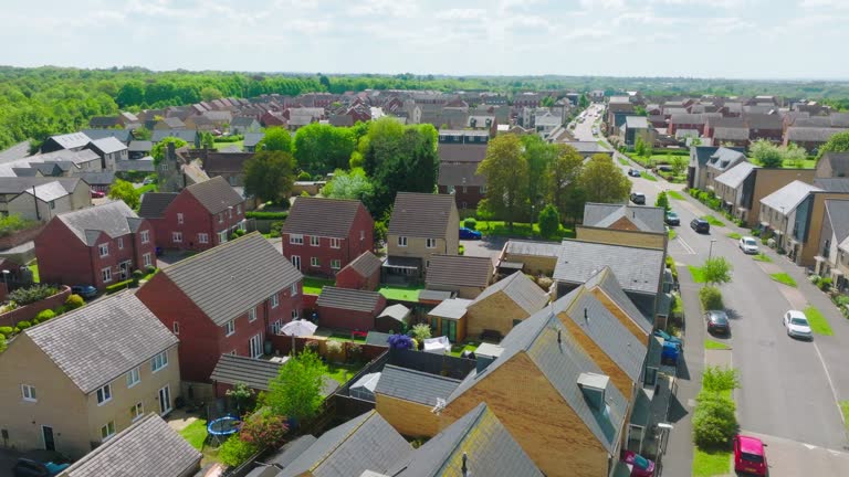 Drone view of houses and streets in a residential area UK