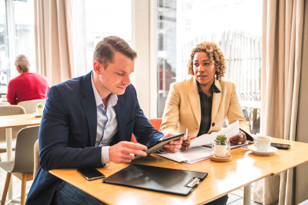 istock Diverse Business Partners Meeting In A Cafe 1492335604