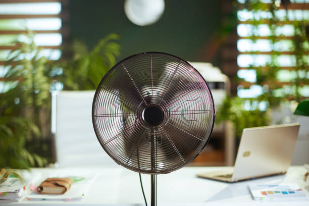 istock metal fan in modern green office 1492340520
