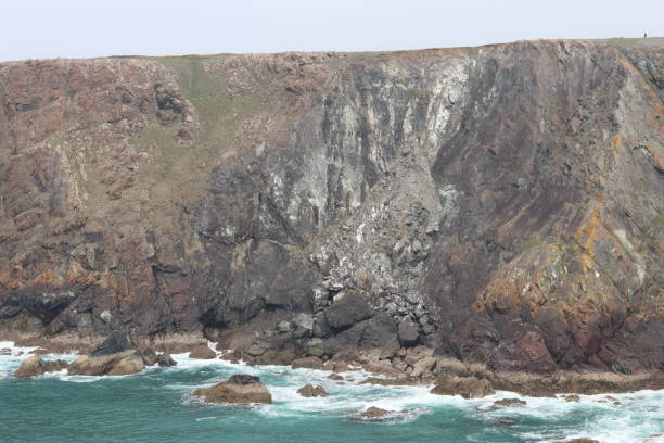 istock Rock fall on a coastal cliff onto the beach below 1492343592