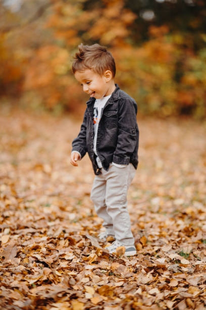 istock Child in the forest smiling and playing 1492345650