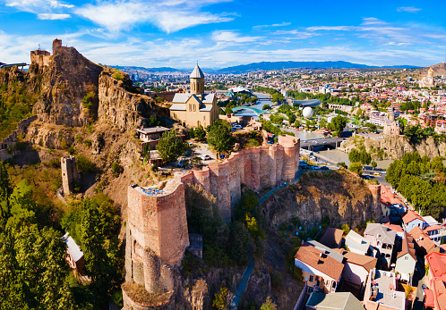 Narikala fortress aerial panoramic view in Tbilisi old town. Tbilisi is the capital and the largest city of Georgia on the banks of the Kura River.