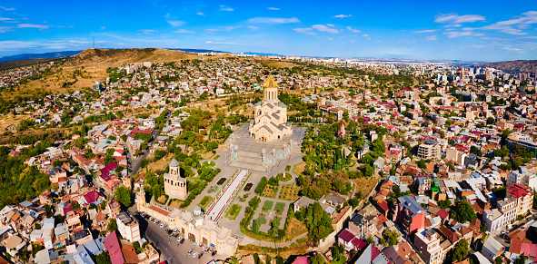 Holy Trinity Cathedral or Tsminda Sameba Church aerial panoramic view in Tbilisi old town. Tbilisi is the capital and the largest city of Georgia, lying on the banks of the Kura River.