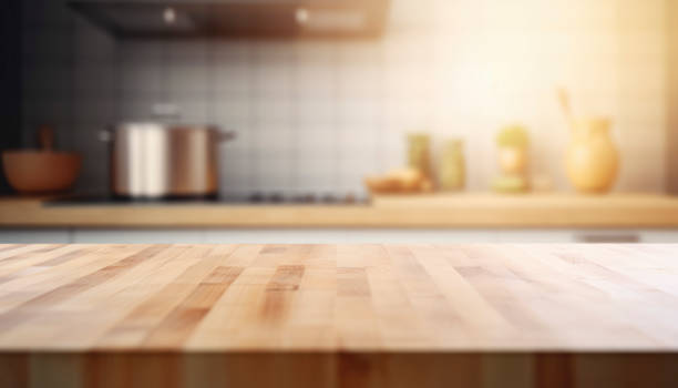 istock empty brown wooden table top and blurred defocused modern kitchen interior background 1492347663