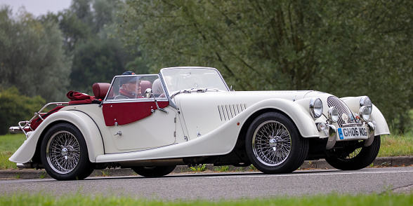 Stony Stratford, Bucks, UK Aug 29th 2021. 2012 white MORGAN ROADSTER classic car travelling on an English country road