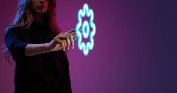 istock Woman clicking on digital virtual image of settings icon. Working with tools, checking mistakes, developing customer friendly software 1492353296