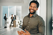 Portrait, digital tablet and black man in office happy, smile and empowered, ambition and mindset. Face and business man or ceo at startup company for management or online project at workplace