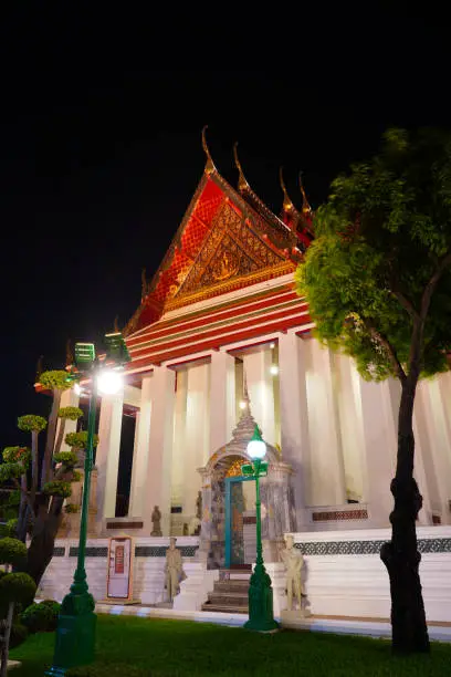 Photo of The Ubosot of Wat Suthat Thepwararam At night